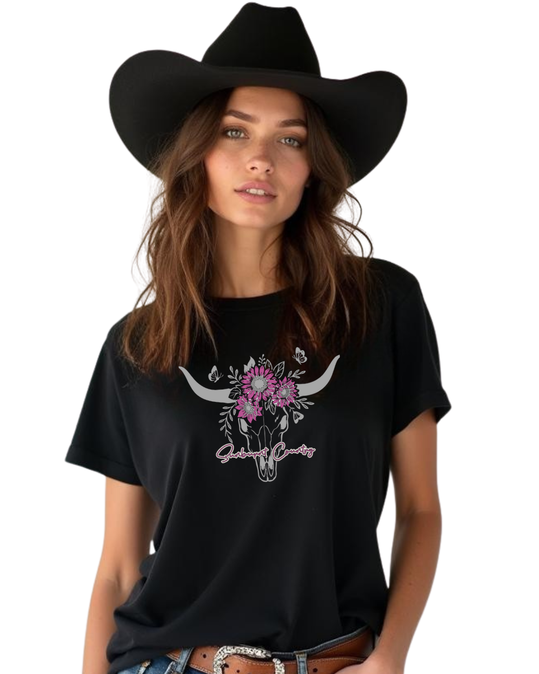 Woman wearing a black t-shirt with a skull and floral design and a black cowboy hat.