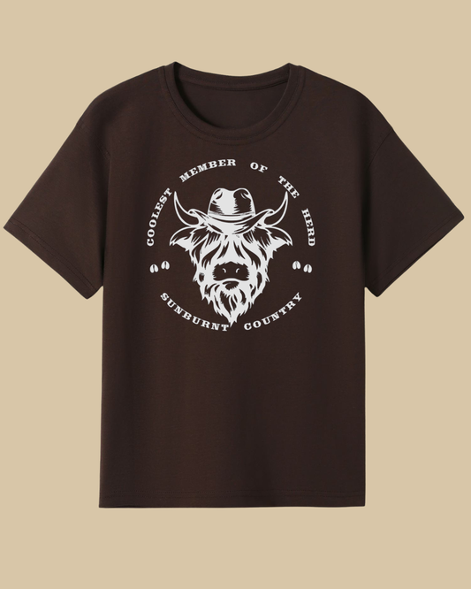 Front of a brown coloured boys country western t-shirt highland cow design by Sunburnt Country Clothing, Australian kids country clothing