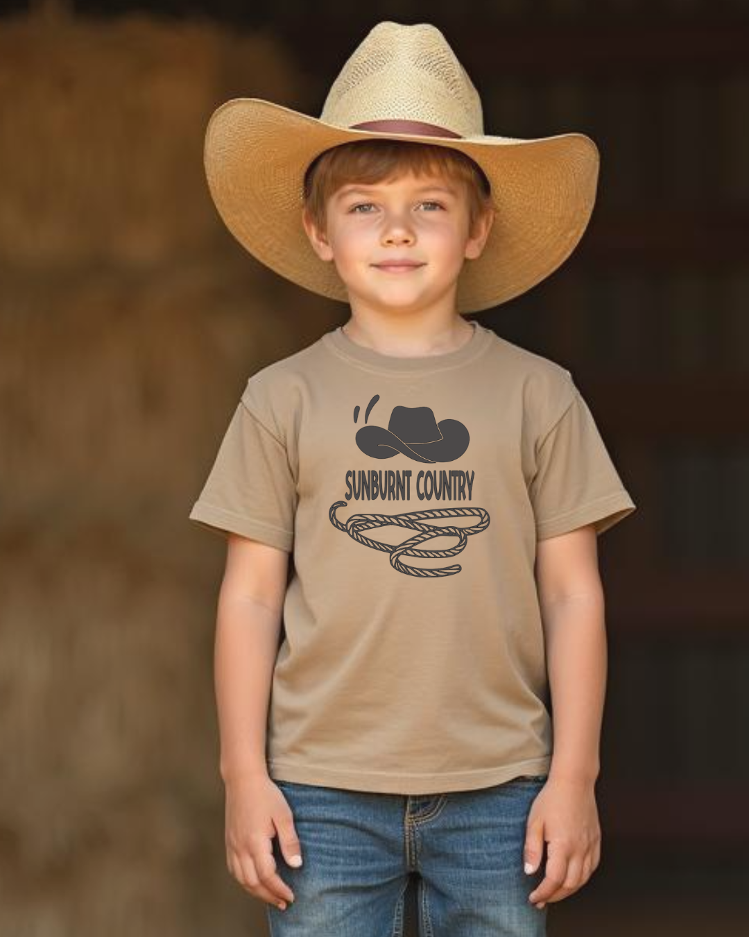 Front of young cowboy child wearing Stone boys country western t-shirt with cowboy hat and lasso design by Sunburnt Country Clothing, Australian kids country clothing