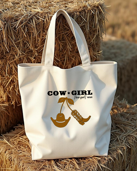 Sunburnt Country Clothing canvas tote bag with 'Cowgirl' design with cowgirl boot and hat on hay bales