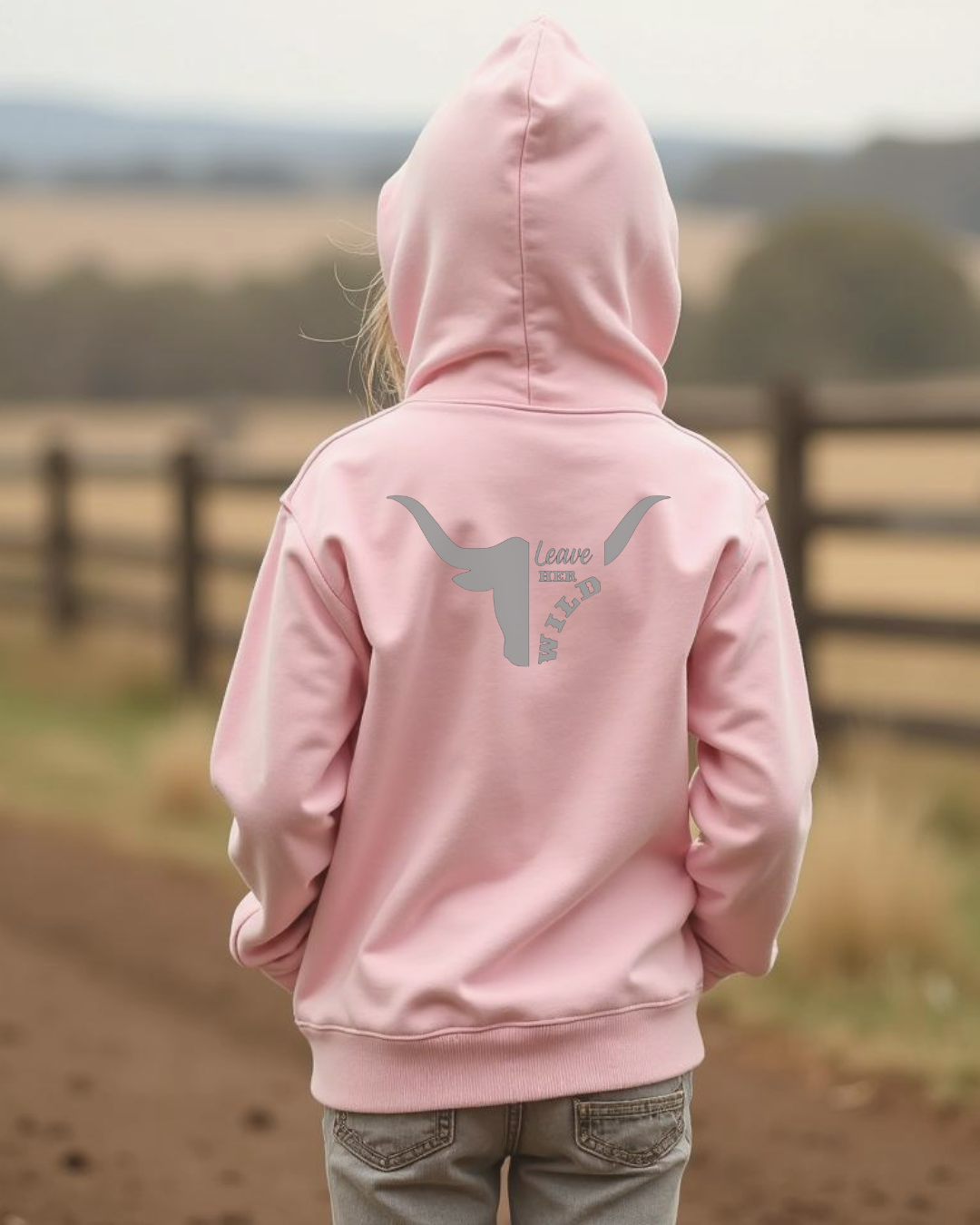 Back of a Young girl wearing a pink coloured girls country western hoodie with small longhorn and text design by Sunburnt Country Clothing, Australian kids country clothing