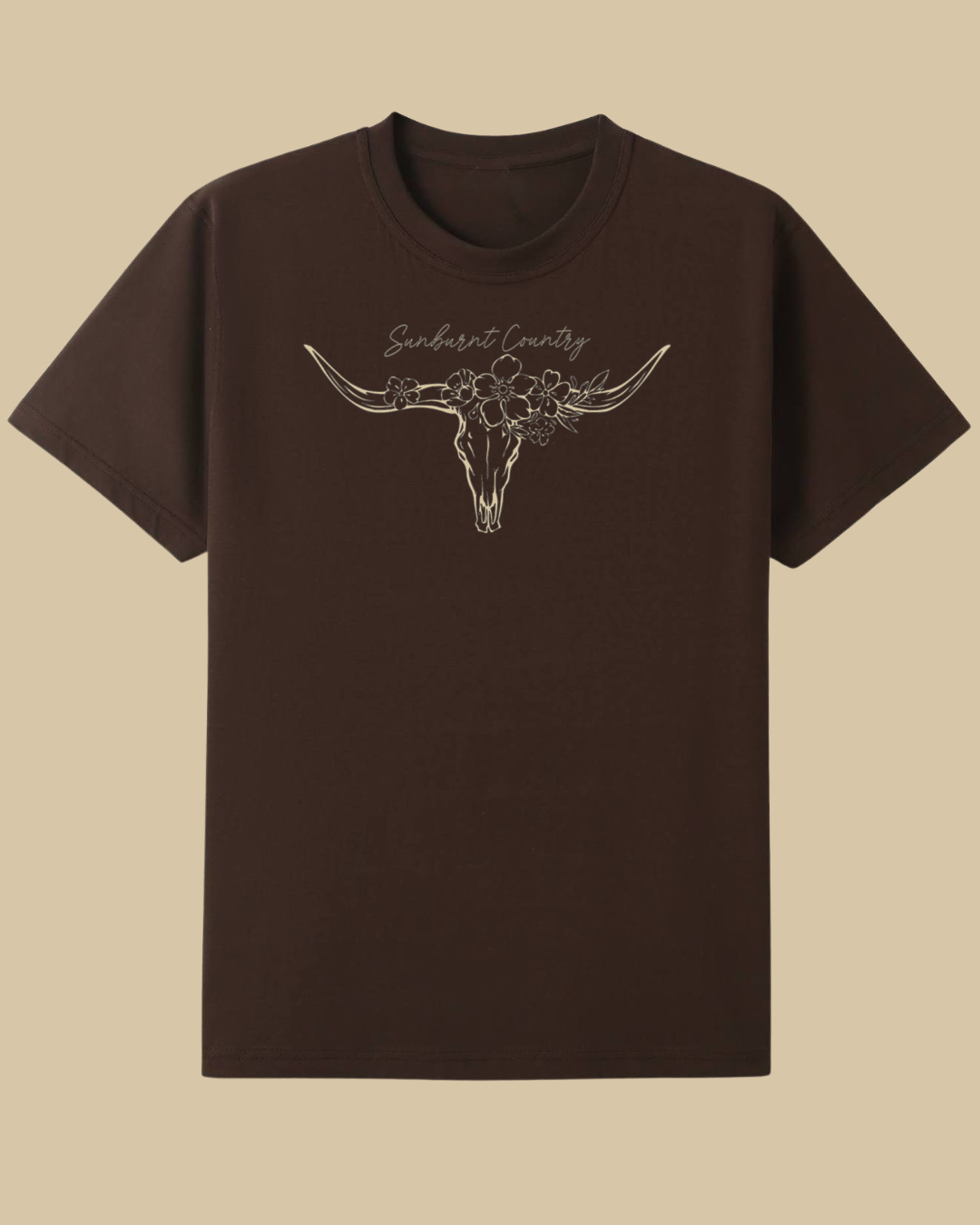 Sunburnt Country Clothing brown t-shirt with longhorn skull design on a beige background